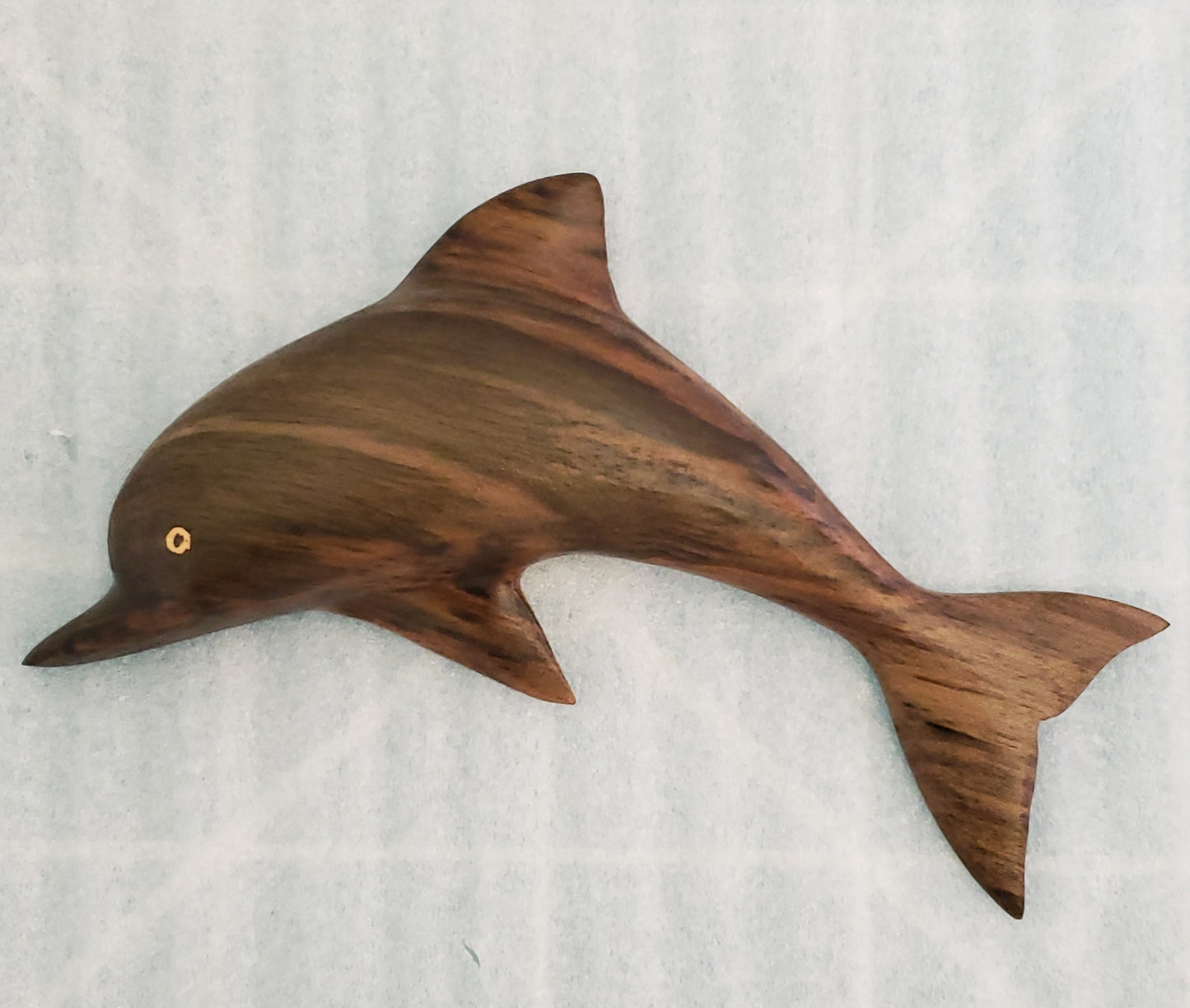 Hand carved Dolphin wall hanging from either Miro Tau or Burau wood
