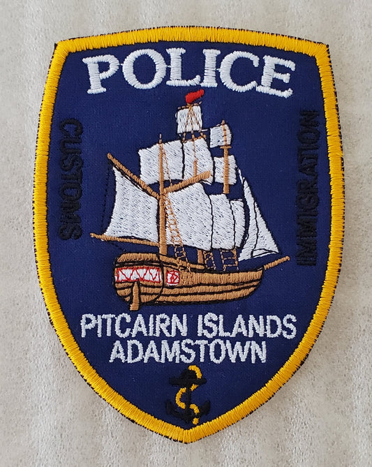 Pitcairn Islands polis - broderade sköldinsignier