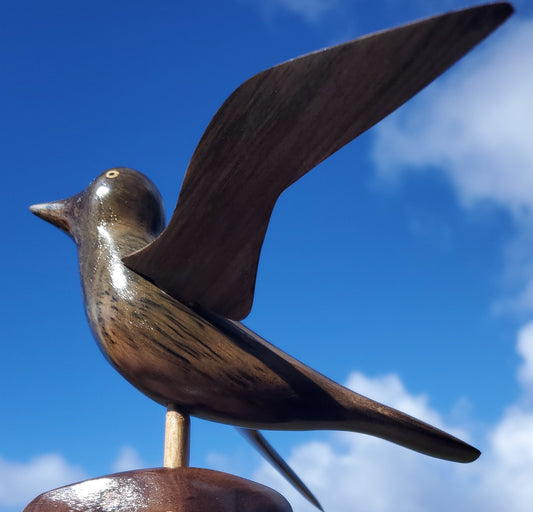 Hand Carved Bird in Flight on a Stand - from Local Burau Wood