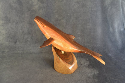Hand carved whale complete with stand