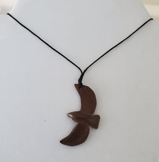 Hand carved Soaring Bird Necklace from Local Tau wood